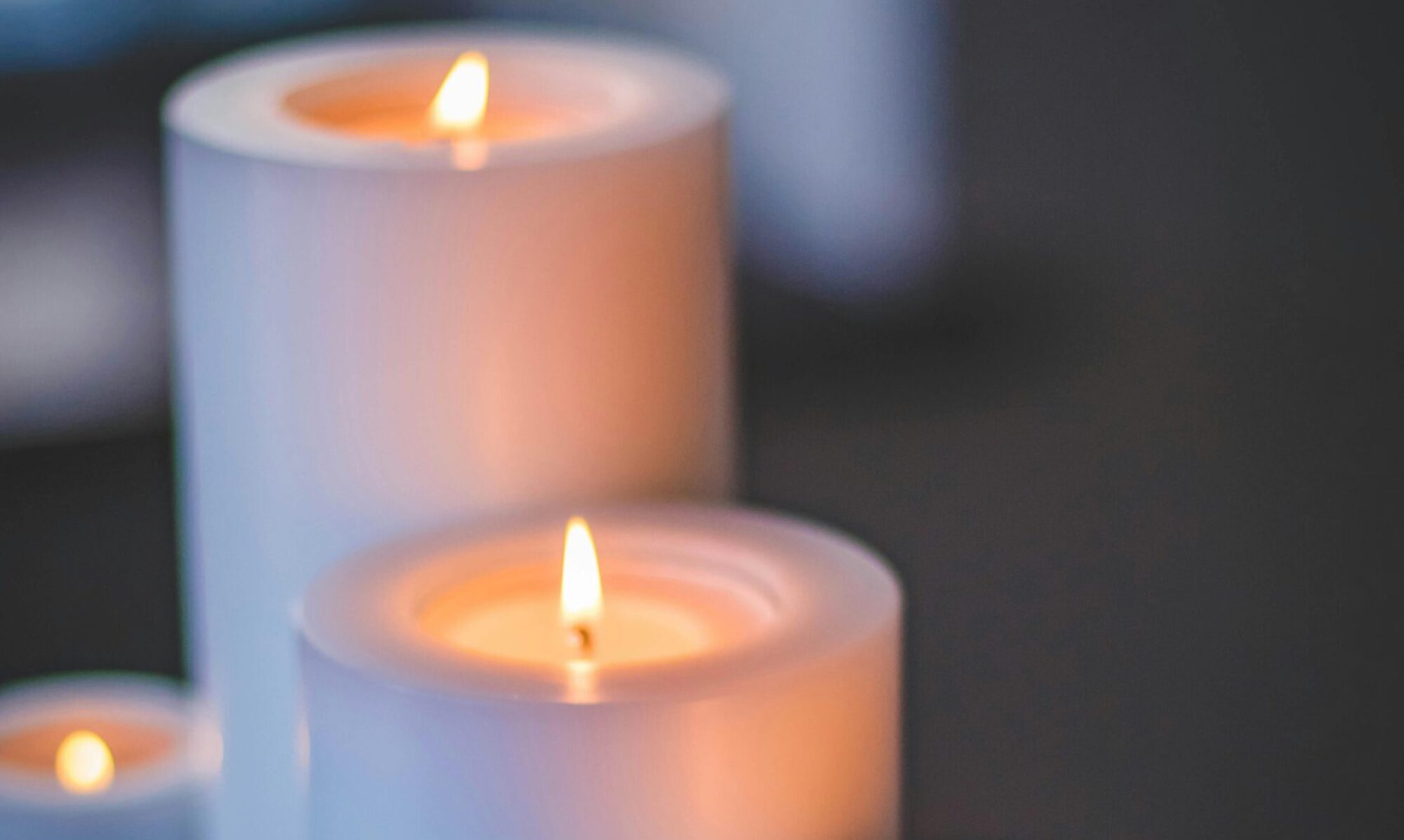 A close-up of a serene candlelight arrangement with a soft, soothing glow.